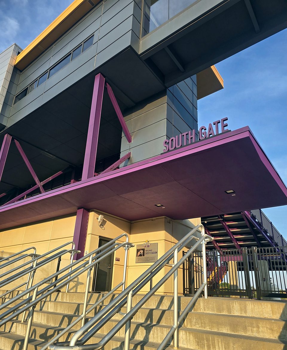 Repainted purple steel canopy, stair stringers and guardrails at Casey Stadium's South Gate